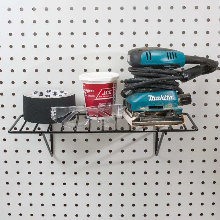 Steel pegboard shelf holding tools and accessories