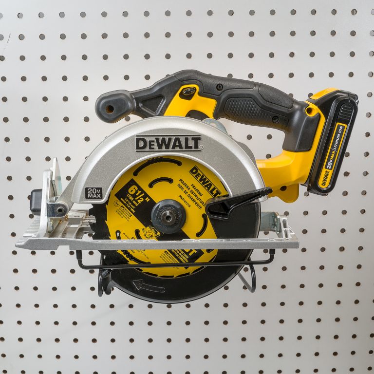 DeWalt circular saw hanging on a pegboard circular saw hanger