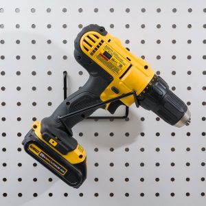 Cradle drill hanger for drill storage